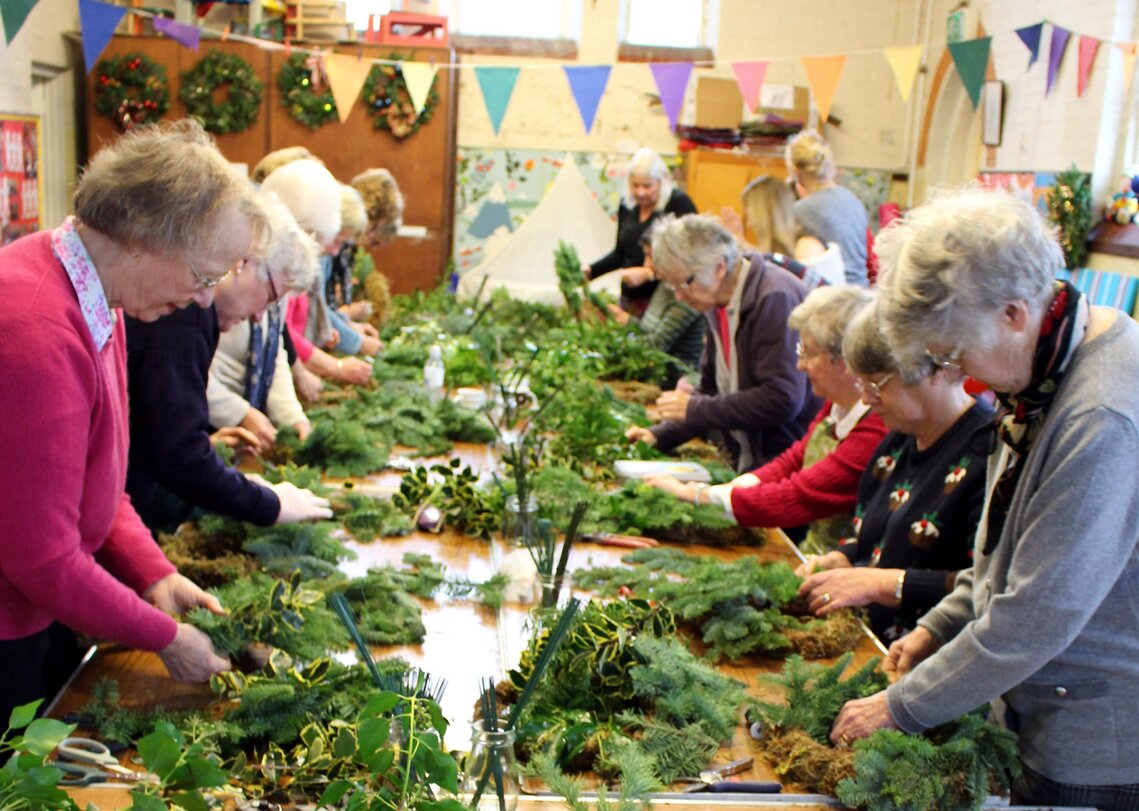 WI members making wreaths